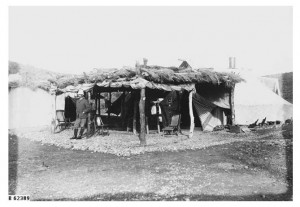 A railway engineer stands outside his camp accommodation during construction of the Great Northern Railway at Beltana, about 1885. 